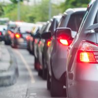 cars in traffic - uninsured and underinsured motorist coverage concept